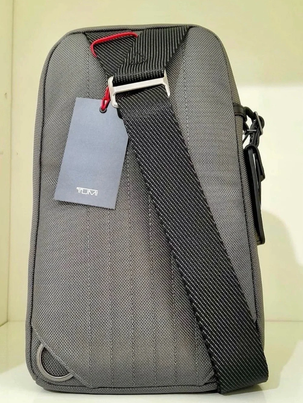 NWT Tumi FIFE Slim Sling Bag Copper and Black